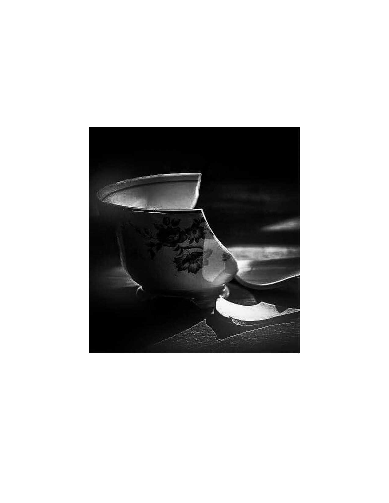 Photograph by Moaya: a broken porcelain teacup in black and white